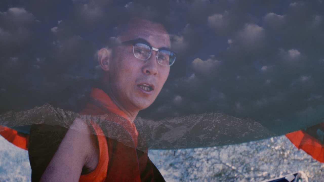 a man with glasses under a cloud filter